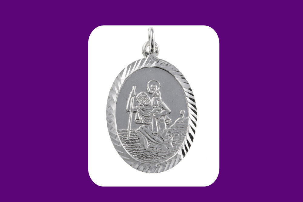 Oval silver St Christopher pendant with detailed engraved design and decorative border