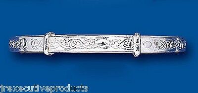 Solid silver child's bangle with intricate engraved floral design by J R Jewellery
