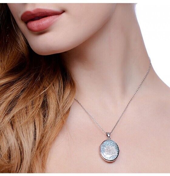 Elegant model wearing a Solid Sterling Silver Blue Rose Oval Locket on a delicate chain