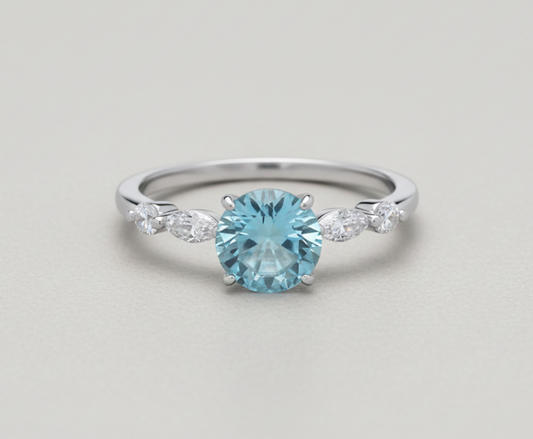 J R Jewellery Sterling Silver Blue Topaz Ring with sparkling side stones for elegant style