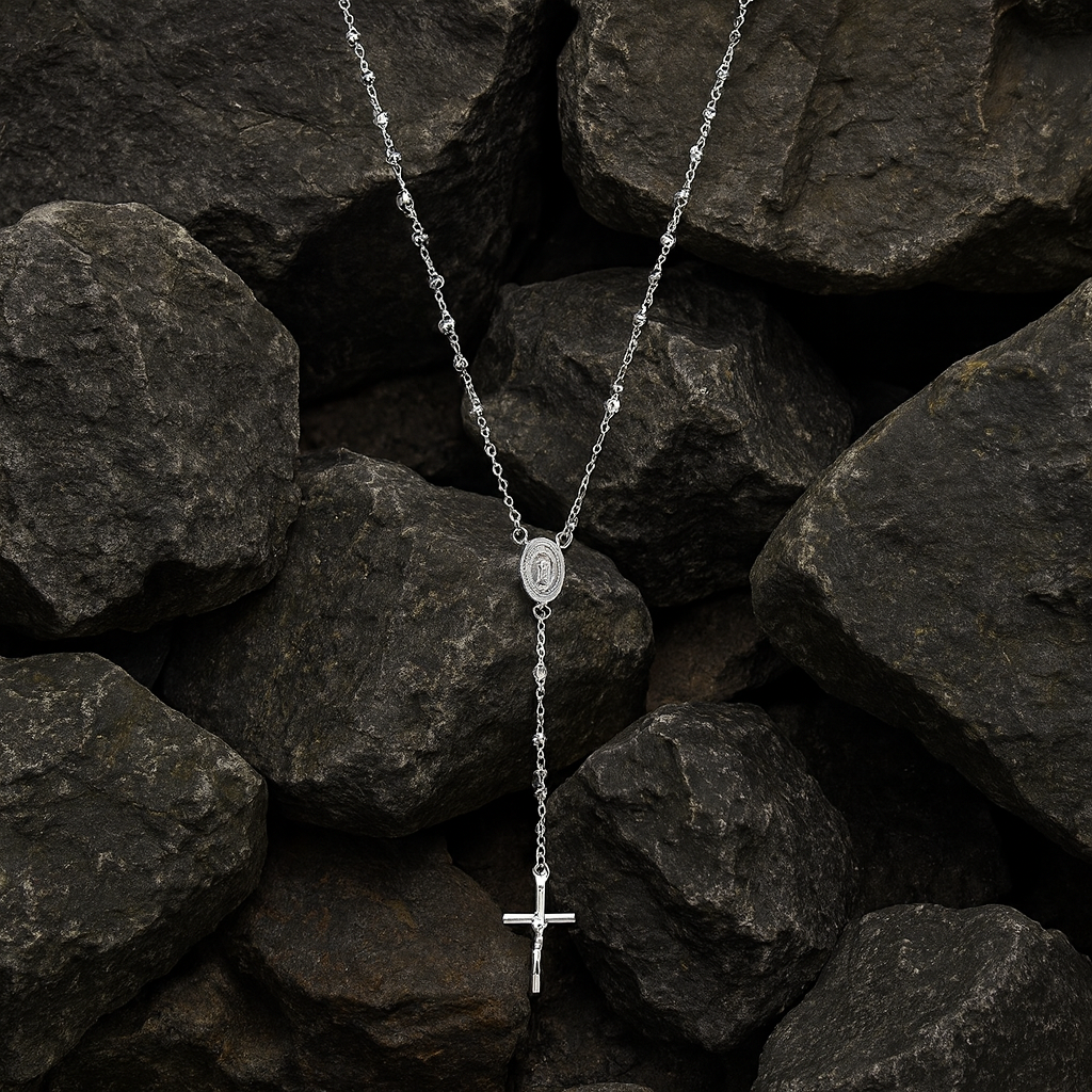 Sterling Silver Rosary Beads with Cross and Medallion on a Background of Dark Stones
