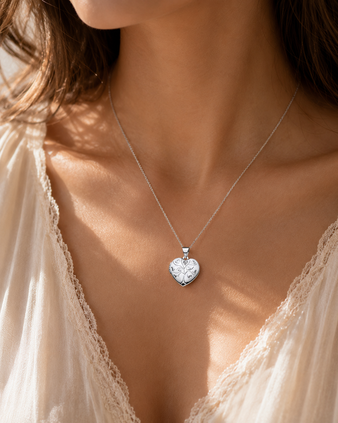 Elegant silver Tree of Life Locket on a delicate chain worn by a woman, perfect for personal keepsakes