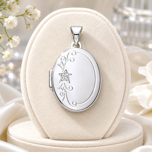 Vintage Silver Oval Locket with intricate floral design displayed on a soft pedestal
