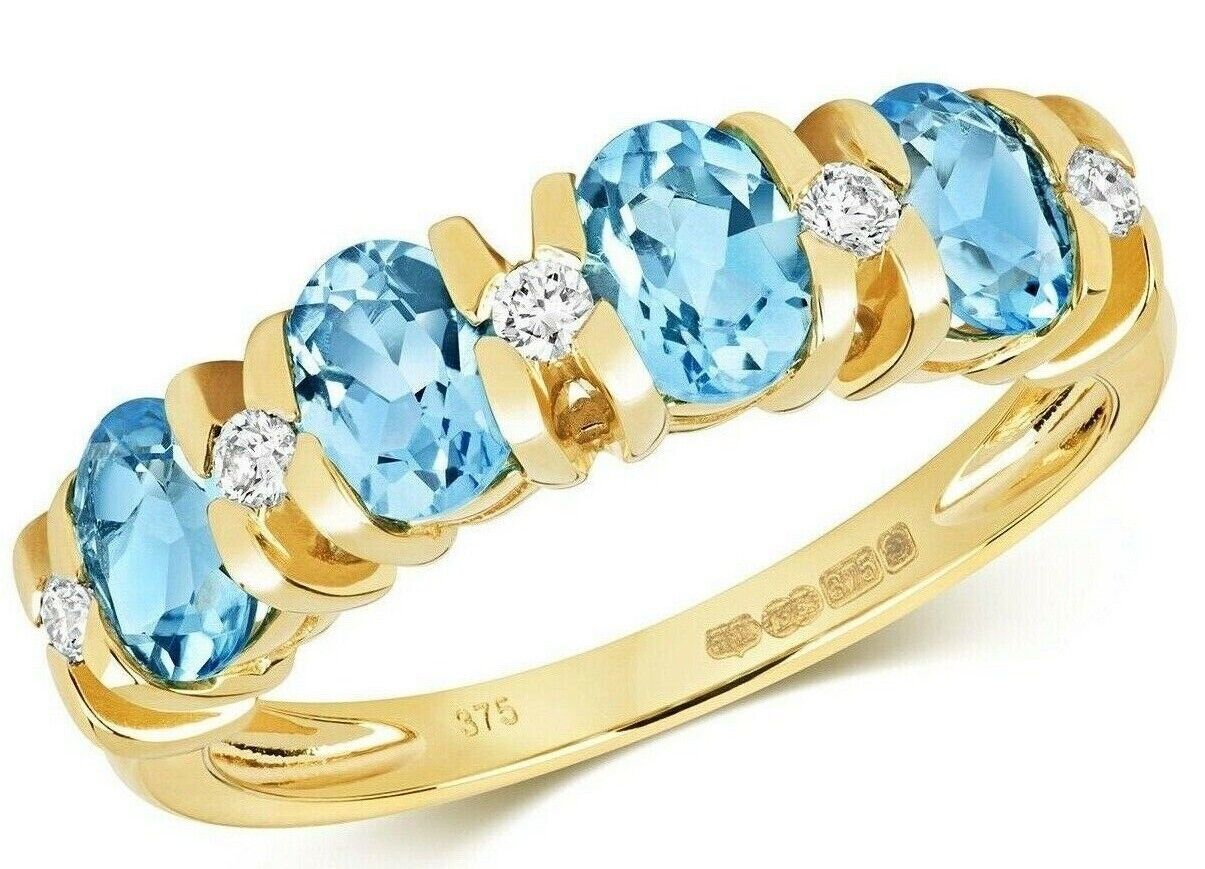 Yellow gold blue topaz and diamond ring with oval blue topaz gemstones and round diamonds